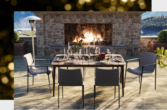 A dining table by an outdoor fireplace.