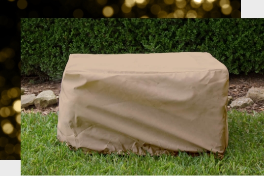 A covered chest on grass.