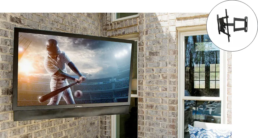 A TV mounted on the brick wall. The mount is shown on the top left of the image.