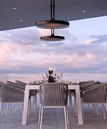 Two ceiling mounted heaters on top of a dining set.