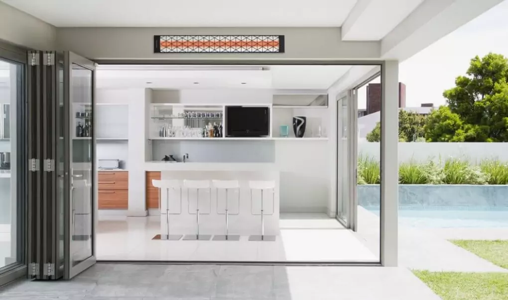 A mounted heater on top of the sliding door frame.