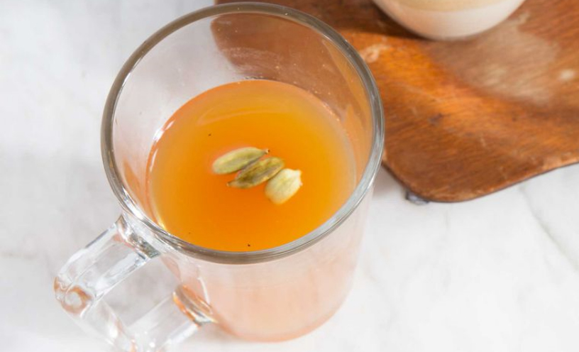 A cup of Cabin Fever, an orange drink with seeds inside