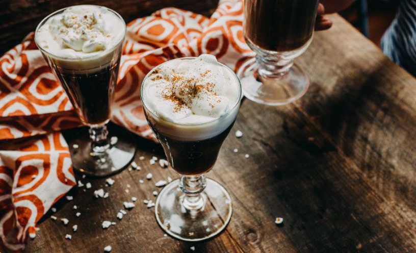 A glass of Irish Coffee Riff, a brown drink with foam topping