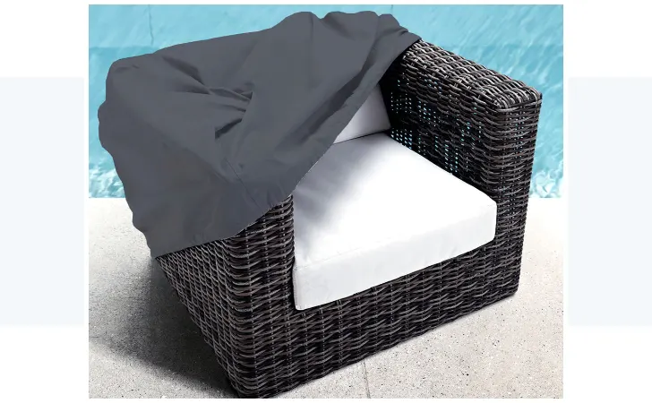 A wicker chair under a cover.