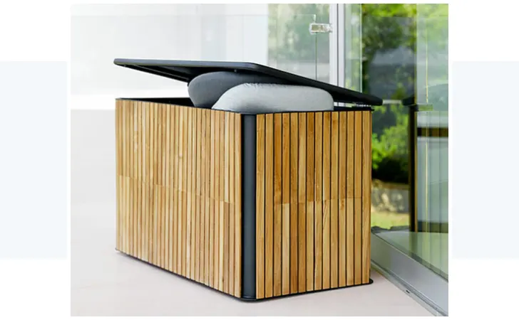 A storage box with cushions inside it.