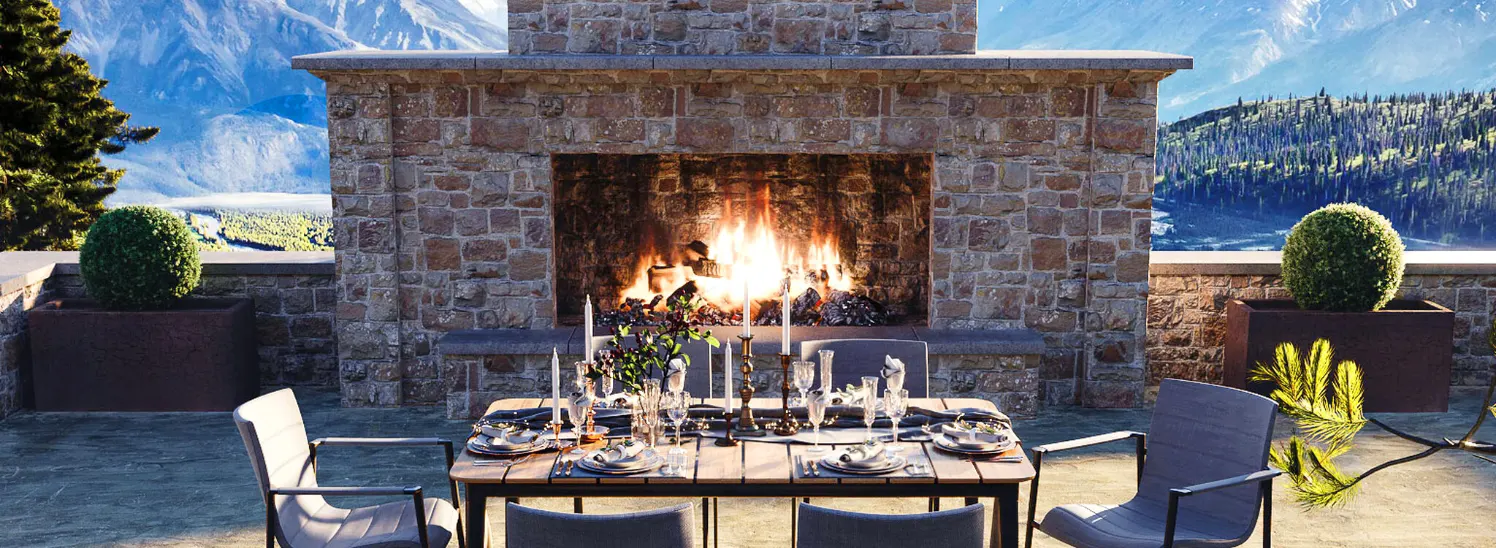A stone fireplace in front of a dining table.