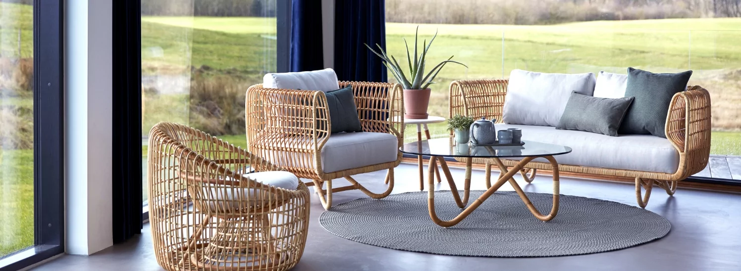 A sofa and two chairs made out of teak.