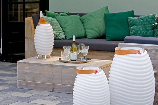 Three LED lamps around an outdoor sitting area