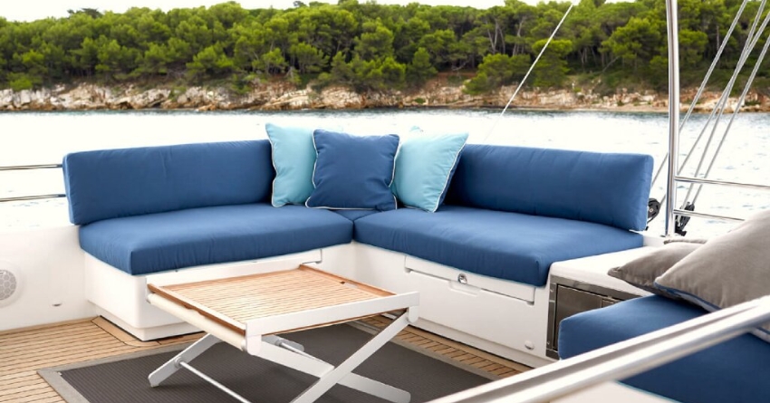 Some benches on a boat with some pillows